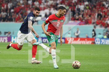 2022-12-14 - Achraf Hakimi of Morocco, Theo Hernandez of France (L) during the FIFA World Cup 2022, Semi-final football match between France and Morocco on December 14, 2022 at Al Bayt Stadium in Al Khor, Qatar - FOOTBALL - WORLD CUP 2022 - 1/2 - FRANCE V MOROCCO - FIFA WORLD CUP - SOCCER
