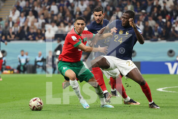 2022-12-14 - Achraf Hakimi of Morocco, Theo Hernandez of France, Ibrahima Konate of France during the FIFA World Cup 2022, Semi-final football match between France and Morocco on December 14, 2022 at Al Bayt Stadium in Al Khor, Qatar - FOOTBALL - WORLD CUP 2022 - 1/2 - FRANCE V MOROCCO - FIFA WORLD CUP - SOCCER