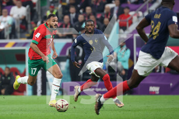 2022-12-14 - Sofiane Boufal of Morocco, Ousmane Dembele of France during the FIFA World Cup 2022, Semi-final football match between France and Morocco on December 14, 2022 at Al Bayt Stadium in Al Khor, Qatar - FOOTBALL - WORLD CUP 2022 - 1/2 - FRANCE V MOROCCO - FIFA WORLD CUP - SOCCER