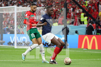 2022-12-14 - Ibrahima Konate of France, Yousseff En-Nesyri of Morocco (L) during the FIFA World Cup 2022, Semi-final football match between France and Morocco on December 14, 2022 at Al Bayt Stadium in Al Khor, Qatar - FOOTBALL - WORLD CUP 2022 - 1/2 - FRANCE V MOROCCO - FIFA WORLD CUP - SOCCER