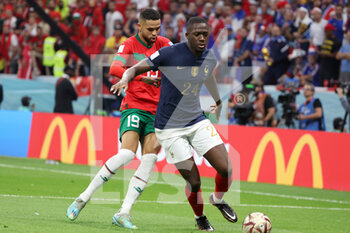 2022-12-14 - Ibrahima Konate of France, Yousseff En-Nesyri of Morocco (L) during the FIFA World Cup 2022, Semi-final football match between France and Morocco on December 14, 2022 at Al Bayt Stadium in Al Khor, Qatar - FOOTBALL - WORLD CUP 2022 - 1/2 - FRANCE V MOROCCO - FIFA WORLD CUP - SOCCER