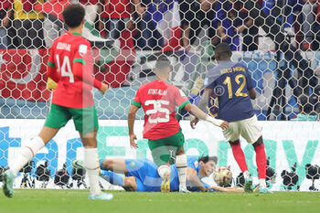 2022-12-14 - Randal Kolo Muani of France scores a goal 2-0 despite Yassine Bounou "Bono" and Yahya Attiat-Allah of Morocco during the FIFA World Cup 2022, Semi-final football match between France and Morocco on December 14, 2022 at Al Bayt Stadium in Al Khor, Qatar - FOOTBALL - WORLD CUP 2022 - 1/2 - FRANCE V MOROCCO - FIFA WORLD CUP - SOCCER