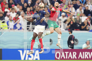 2022-12-14 - Marcus Thuram of France and Sofyan Amrabat of Morocco during the FIFA World Cup 2022, Semi-final football match between France and Morocco on December 14, 2022 at Al Bayt Stadium in Al Khor, Qatar - FOOTBALL - WORLD CUP 2022 - 1/2 - FRANCE V MOROCCO - FIFA WORLD CUP - SOCCER