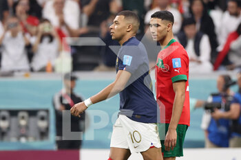 2022-12-14 - Kylian Mbappe of France, Achraf Hakimi of Morocco during the FIFA World Cup 2022, Semi-final football match between France and Morocco on December 14, 2022 at Al Bayt Stadium in Al Khor, Qatar - FOOTBALL - WORLD CUP 2022 - 1/2 - FRANCE V MOROCCO - FIFA WORLD CUP - SOCCER