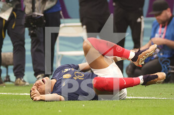 2022-12-14 - Kylian Mbappe of France on the ground during the FIFA World Cup 2022, Semi-final football match between France and Morocco on December 14, 2022 at Al Bayt Stadium in Al Khor, Qatar - FOOTBALL - WORLD CUP 2022 - 1/2 - FRANCE V MOROCCO - FIFA WORLD CUP - SOCCER