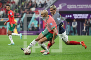 2022-12-14 - Sofyan Amrabat of Morocco, Antoine Griezmann of France during the FIFA World Cup 2022, Semi-final football match between France and Morocco on December 14, 2022 at Al Bayt Stadium in Al Khor, Qatar - FOOTBALL - WORLD CUP 2022 - 1/2 - FRANCE V MOROCCO - FIFA WORLD CUP - SOCCER