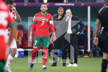 2022-12-17 - Hakim Ziyech of Morocco, Coach of Morocco Walid Regragui (R) during the FIFA World Cup 2022, third place football match between Croatia and Morocco on December 17, 2022 at Khalifa International Stadium in Ar-Rayyan, Qatar - FOOTBALL - WORLD CUP 2022 - 3RD PLACE - CROATIA V MOROCCO - FIFA WORLD CUP - SOCCER