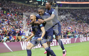 2022-12-18 - Kylian Mbappe of France celebrates his goal 2-2 with Marcus Thuram, Eduardo Camavinga during the FIFA World Cup 2022, Final football match between Argentina and France on December 18, 2022 at Lusail Stadium in Al Daayen, Qatar - FOOTBALL - WORLD CUP 2022 - FINAL - ARGENTINA V FRANCE - FIFA WORLD CUP - SOCCER