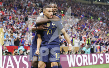 2022-12-18 - Kylian Mbappe of France celebrates his goal 2-2 with Marcus Thuram during the FIFA World Cup 2022, Final football match between Argentina and France on December 18, 2022 at Lusail Stadium in Al Daayen, Qatar - FOOTBALL - WORLD CUP 2022 - FINAL - ARGENTINA V FRANCE - FIFA WORLD CUP - SOCCER