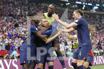 2022-12-18 - Kylian Mbappe of France celebrates his goal 2-2 with teammates during the FIFA World Cup 2022, Final football match between Argentina and France on December 18, 2022 at Lusail Stadium in Al Daayen, Qatar - FOOTBALL - WORLD CUP 2022 - FINAL - ARGENTINA V FRANCE - FIFA WORLD CUP - SOCCER