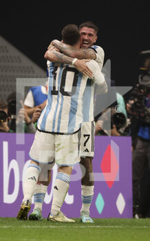 2022-12-18 - Lionel Messi of Argentina celebrates his first goal on a penalty kick with Rodrigo De Paul during the FIFA World Cup 2022, Final football match between Argentina and France on December 18, 2022 at Lusail Stadium in Al Daayen, Qatar - FOOTBALL - WORLD CUP 2022 - FINAL - ARGENTINA V FRANCE - FIFA WORLD CUP - SOCCER