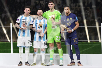 2022-12-18 - Best young Player Enzo Fernandez of Argentina, Best player Lionel Messi of Argentina, Best Goalkeeper Emiliano Martinez of Argentina and Best goal scorer Kylian Mbappe of France after the FIFA World Cup 2022, Final football match between Argentina and France on December 18, 2022 at Lusail Stadium in Al Daayen, Qatar - FOOTBALL - WORLD CUP 2022 - FINAL - ARGENTINA V FRANCE - FIFA WORLD CUP - SOCCER