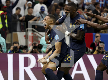 2022-12-18 - Kylian Mbappe of France celebrates his goal with Marcus Thuram during the FIFA World Cup 2022, Final football match between Argentina and France on December 18, 2022 at Lusail Stadium in Al Daayen, Qatar - FOOTBALL - WORLD CUP 2022 - FINAL - ARGENTINA V FRANCE - FIFA WORLD CUP - SOCCER