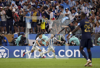 2022-12-18 - Lionel Messi of Argentina celebrates his second goal with Lautaro Martinez (left) during the FIFA World Cup 2022, Final football match between Argentina and France on December 18, 2022 at Lusail Stadium in Al Daayen, Qatar - FOOTBALL - WORLD CUP 2022 - FINAL - ARGENTINA V FRANCE - FIFA WORLD CUP - SOCCER