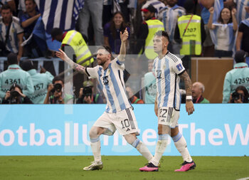 2022-12-18 - Lionel Messi of Argentina celebrates his second goal with Lautaro Martinez during the FIFA World Cup 2022, Final football match between Argentina and France on December 18, 2022 at Lusail Stadium in Al Daayen, Qatar - FOOTBALL - WORLD CUP 2022 - FINAL - ARGENTINA V FRANCE - FIFA WORLD CUP - SOCCER