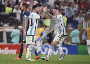 2022-12-18 - Lionel Messi of Argentina celebrates his second goal with Alexis Mac Allister during the FIFA World Cup 2022, Final football match between Argentina and France on December 18, 2022 at Lusail Stadium in Al Daayen, Qatar - FOOTBALL - WORLD CUP 2022 - FINAL - ARGENTINA V FRANCE - FIFA WORLD CUP - SOCCER