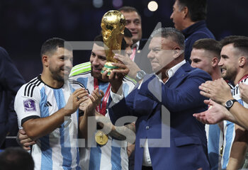 2022-12-18 - President of Argentine Football Association AFA Claudio Tapia - holding the World Cup - celebrates during the trophy ceremony following the FIFA World Cup 2022, Final football match between Argentina and France on December 18, 2022 at Lusail Stadium in Al Daayen, Qatar - FOOTBALL - WORLD CUP 2022 - FINAL - ARGENTINA V FRANCE - FIFA WORLD CUP - SOCCER