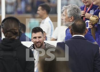 2022-12-18 - Lionel Messi of Argentina with his father Jorge Messi following the FIFA World Cup 2022, Final football match between Argentina and France on December 18, 2022 at Lusail Stadium in Al Daayen, Qatar - FOOTBALL - WORLD CUP 2022 - FINAL - ARGENTINA V FRANCE - FIFA WORLD CUP - SOCCER