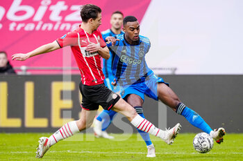 2022-01-23 - Ryan Gravenberch of Ajax, Olivier Boscagli of PSV Eindhoven during the Netherlands championship Eredivisie football match between PSV Eindhoven and Ajax on January 23, 2022 at Philips Stadion in Eindhoven, Netherlands - PSV EINDHOVEN VS AJAX - NETHERLANDS EREDIVISIE - SOCCER