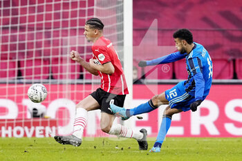 2022-01-23 - Noussair Mazraoui of Ajax scores a goal 1-2, Armando Obispo of PSV during the Netherlands championship Eredivisie football match between PSV Eindhoven and Ajax on January 23, 2022 at Philips Stadion in Eindhoven, Netherlands - PSV EINDHOVEN VS AJAX - NETHERLANDS EREDIVISIE - SOCCER