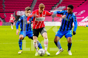 2022-01-23 - Yorbe Vertessen of PSV Eindhoven, Jurrien Timber of Ajax, Lisandro Martinez of Ajax during the Netherlands championship Eredivisie football match between PSV Eindhoven and Ajax on January 23, 2022 at Philips Stadion in Eindhoven, Netherlands - PSV EINDHOVEN VS AJAX - NETHERLANDS EREDIVISIE - SOCCER