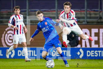 2022-01-22 - Daan Rots of FC Twente battles for the ball with Max Svensson of Willem II during the Netherlands championship Eredivisie football match between Willem II and FC Twente on January 22, 2022 at Koning Willem II Stadion in Tilburg, Netherlands - WILLEM II VS FC TWENTE - NETHERLANDS EREDIVISIE - SOCCER
