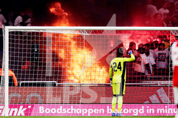 2022-03-20 - Fire next to the Ajax fans during the Netherlands championship Eredivisie football match between AFC Ajax and Feyenoord on March 20, 2022 at Johan Cruijff Arena in Amsterdam, Netherlands - AFC AJAX VS FEYENOORD - NETHERLANDS EREDIVISIE - SOCCER