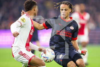 2022-11-06 - Devyne Rensch of Ajax battles for the ball with Xavi Simons of PSV during the Netherlands championship Eredivisie football match between Ajax and PSV on November 6, 2022 at the Johan Cruijff Arena in Amsterdam, Netherlands - FOOTBALL - NETHERLANDS CHAMP - AJAX V PSV - NETHERLANDS EREDIVISIE - SOCCER