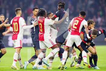 2022-11-06 - Clash between Calvin Bassey of Ajax, Steven Bergwijn of Ajax and Ibrahim Sangare of PSV during the Netherlands championship Eredivisie football match between Ajax and PSV on November 6, 2022 at the Johan Cruijff Arena in Amsterdam, Netherlands - FOOTBALL - NETHERLANDS CHAMP - AJAX V PSV - NETHERLANDS EREDIVISIE - SOCCER