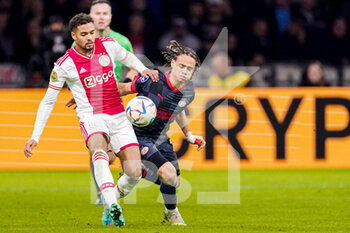 2022-11-06 - Devyne Rensch of Ajax, Xavi Simons of PSV during the Netherlands championship Eredivisie football match between Ajax and PSV on November 6, 2022 at the Johan Cruijff Arena in Amsterdam, Netherlands - FOOTBALL - NETHERLANDS CHAMP - AJAX V PSV - NETHERLANDS EREDIVISIE - SOCCER