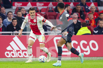 2022-11-06 - Dusan Tadic of Ajax battles for the ball with Phillipp Mwene of PSV during the Netherlands championship Eredivisie football match between Ajax and PSV on November 6, 2022 at the Johan Cruijff Arena in Amsterdam, Netherlands - FOOTBALL - NETHERLANDS CHAMP - AJAX V PSV - NETHERLANDS EREDIVISIE - SOCCER