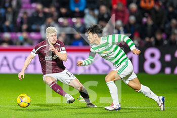 2022-01-26 - Rey Hatate (41) of Celtic FC and Alex Cochrane (17) of Heart of Midlothian FC during the Scottish championship, Cinch SPFL Premiership football match between Heart of Midlothian and Celtic on January 26, 2022 at Tynecastle Park in Edinburgh, Scotland - HEART OF MIDLOTHIAN VS CELTIC - SCOTTISH PREMIERSHIP - SOCCER