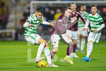 2022-01-26 - Nir Bitton (6) of Celtic FC and Barrie McKay (18) of Heart of Midlothian FC during the Scottish championship, Cinch SPFL Premiership football match between Heart of Midlothian and Celtic on January 26, 2022 at Tynecastle Park in Edinburgh, Scotland - HEART OF MIDLOTHIAN VS CELTIC - SCOTTISH PREMIERSHIP - SOCCER