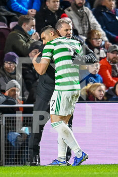 2022-01-26 - Georgios Giakoumakis (7) of Celtic FC celebrates his goal 0-2 with manager of Celtic FC, Ange Postecoglou during the Scottish championship, Cinch SPFL Premiership football match between Heart of Midlothian and Celtic on January 26, 2022 at Tynecastle Park in Edinburgh, Scotland - HEART OF MIDLOTHIAN VS CELTIC - SCOTTISH PREMIERSHIP - SOCCER