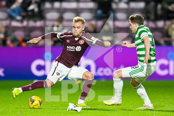 2022-01-26 - Nathaniel Atkinson (12) of Heart of Midlothian FC and James Forrest (49) of Celtic FC during the Scottish championship, Cinch SPFL Premiership football match between Heart of Midlothian and Celtic on January 26, 2022 at Tynecastle Park in Edinburgh, Scotland - HEART OF MIDLOTHIAN VS CELTIC - SCOTTISH PREMIERSHIP - SOCCER