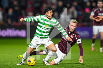 2022-01-26 - Rey Hatate (41) of Celtic FC and Nathaniel Atkinson (12) of Heart of Midlothian FC during the Scottish championship, Cinch SPFL Premiership football match between Heart of Midlothian and Celtic on January 26, 2022 at Tynecastle Park in Edinburgh, Scotland - HEART OF MIDLOTHIAN VS CELTIC - SCOTTISH PREMIERSHIP - SOCCER