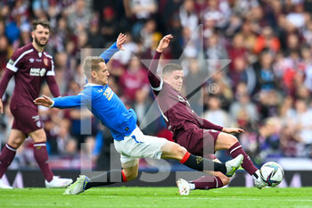 2022-05-21 - Rangers Steven Davis and Hearts Cammy Devlin during the Scottish Cup, Final football match between Rangers and Heart of Midlothian on May 21, 2022 at Hampden Park in Glasgow, Scotland - SCOTTISH CUP FINAL - RANGERS VS HEART OF MIDLOTHIAN - SCOTTISH PREMIERSHIP - SOCCER