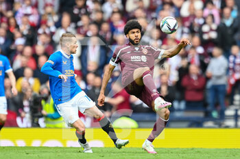 2022-05-21 - Hearts Ellis Simms controls the ball ahead of Rangers Steven Davis during the Scottish Cup, Final football match between Rangers and Heart of Midlothian on May 21, 2022 at Hampden Park in Glasgow, Scotland - SCOTTISH CUP FINAL - RANGERS VS HEART OF MIDLOTHIAN - SCOTTISH PREMIERSHIP - SOCCER