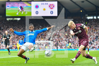 2022-05-21 - Rangers Amad Diallo tries to stop the cross of Hearts Alex Cochrane during the Scottish Cup, Final football match between Rangers and Heart of Midlothian on May 21, 2022 at Hampden Park in Glasgow, Scotland - SCOTTISH CUP FINAL - RANGERS VS HEART OF MIDLOTHIAN - SCOTTISH PREMIERSHIP - SOCCER