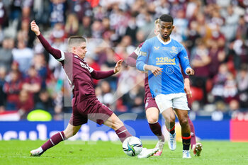 2022-05-21 - Hearts Cammy Devlin tackles Rangers Amad Diallo during the Scottish Cup, Final football match between Rangers and Heart of Midlothian on May 21, 2022 at Hampden Park in Glasgow, Scotland - SCOTTISH CUP FINAL - RANGERS VS HEART OF MIDLOTHIAN - SCOTTISH PREMIERSHIP - SOCCER