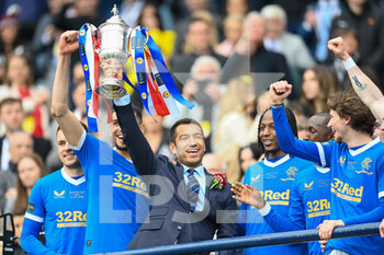 2022-05-21 - Rangers manager, Giovanni van Bronckhorst celebrates with the trophy after the Scottish Cup, Final football match between Rangers and Heart of Midlothian on May 21, 2022 at Hampden Park in Glasgow, Scotland - SCOTTISH CUP FINAL - RANGERS VS HEART OF MIDLOTHIAN - SCOTTISH PREMIERSHIP - SOCCER