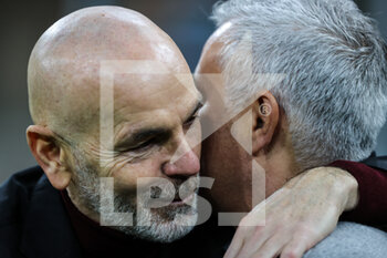 2022-01-06 - Stefano Pioli Head Coach of AC Milan hugs Jose Mourinho Head Coach of AS Roma during the Serie A 2021/22 football match between AC Milan and AS Roma at Giuseppe Meazza Stadium, Milan, Italy on January 06, 2022 - AC MILAN VS AS ROMA - ITALIAN SERIE A - SOCCER