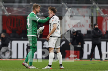 2022-01-17 - Ivan Provedel of Spezia Calcio and Salvador Ferrer Canals of Spezia Calcio celebrate the victory at the end of the match during the Serie A 2021/22 football match between AC Milan and Spezia Calcio at Giuseppe Meazza Stadium, Milan, Italy on January 17, 2022 - AC MILAN VS SPEZIA CALCIO - ITALIAN SERIE A - SOCCER