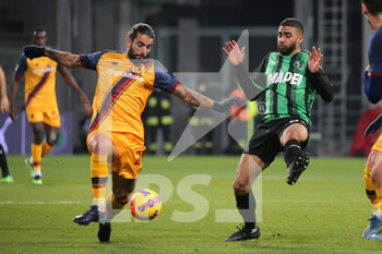 2022-02-13 - Gregoire Defrel of US SASSUOLO competes for the ball with Sergio Oliveira of AS ROMA during the Serie A match between US Sassuolo and AS ROMA at Mapei Stadium-Città del Tricolore on February 13, 2022 in Reggio Emilia, Italy. - US SASSUOLO VS AS ROMA - ITALIAN SERIE A - SOCCER