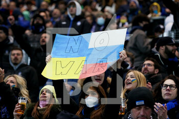 2022-02-28 - Atalanta BC fan holds a placard reading 