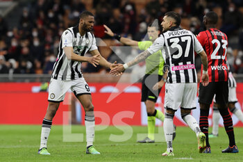 2022-02-25 - Beto of Udinese Calcio and Roberto Pereyra of Udinese Calcio during the Serie A 2021/22 football match between AC Milan and Udinese Calcio at Giuseppe Meazza Stadium, Milan, Italy on February 25, 2022 - AC MILAN VS UDINESE CALCIO - ITALIAN SERIE A - SOCCER