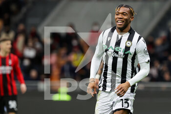 2022-02-25 - Destiny Udogie of Udinese Calcio celebrates after scoring a goal during the Serie A 2021/22 football match between AC Milan and Udinese Calcio at Giuseppe Meazza Stadium, Milan, Italy on February 25, 2022 - AC MILAN VS UDINESE CALCIO - ITALIAN SERIE A - SOCCER