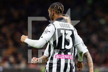 2022-02-25 - Destiny Udogie of Udinese Calcio celebrates after scoring a goal during the Serie A 2021/22 football match between AC Milan and Udinese Calcio at Giuseppe Meazza Stadium, Milan, Italy on February 25, 2022 - AC MILAN VS UDINESE CALCIO - ITALIAN SERIE A - SOCCER