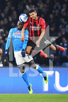 2022-03-06 - Milan's forward Junior Messias jump for the ball with Napoli's defender Kalidou Koulibaly  - SSC NAPOLI VS AC MILAN - ITALIAN SERIE A - SOCCER