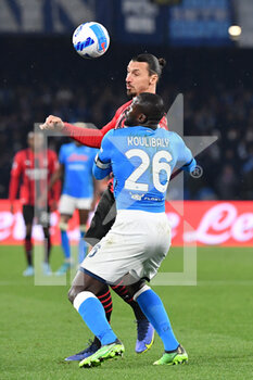 2022-03-06 - Milan's forward Zlatan Ibrahimovic compete for the ball with Napoli's defender Kalidou Koulibaly  - SSC NAPOLI VS AC MILAN - ITALIAN SERIE A - SOCCER